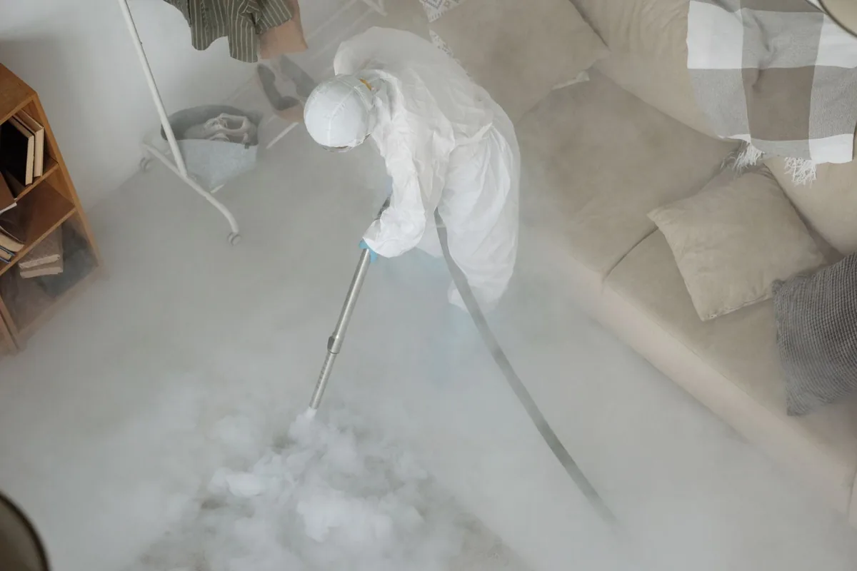 Biohazard cleanup technician in protective equipment, Chico, CA